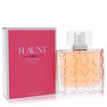 Flaunt Pour Femme 3.4 oz EDP in a stylish clear honeycomb glass bottle with silver sprayer, next to its vibrant hot pink box.