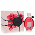 Luxurious Viktor & Rolf Flowerbomb Ruby Orchid 3.4 oz EDP. Ruby red faceted bottle with black flower, beside its pink orchid box.