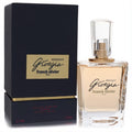 Giorgia Midnight Franck Olivier 2.5 oz women's perfume. Clear faceted glass bottle with warm amber liquid, gold accents, and sleek dark box.