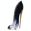 Luxurious Carolina Herrera Good Girl Legere perfume bottle, a dark blue to clear glass high-heel with a striking gold stiletto.
