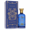 Gucci A Song for the Rose 3.3 oz EDP. Elegant blue glass bottle with gold cap and ornate floral details, next to its luxurious matching box.