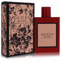 Gucci Bloom Ambrosia Di Fiori 3.3 oz intense perfume. Vibrant red glass bottle with peach label, next to its elegant black floral box.