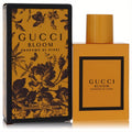 Discover Gucci Bloom Profumo Di Fiori 1.6 oz EDP. Vibrant orange rectangular bottle and matching box with elegant black floral design.