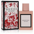 Iconic Gucci Bloom 1.6 oz Eau De Parfum in a sleek pale pink bottle, with its vibrant red floral box.