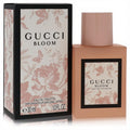 Gucci Bloom 1 oz Eau De Toilette: elegant matte peach-pink square bottle, beautifully adorned with a floral and butterfly patterned box.
