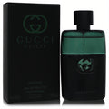 Elevate your style with Gucci Guilty Essence EDT for men. Sleek black bottle, vibrant green top, and iconic G logo.