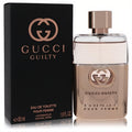 Gucci Guilty Pour Femme 1.6 oz EDT: a sophisticated rose gold bottle and elegant black box, embodying modern luxury.