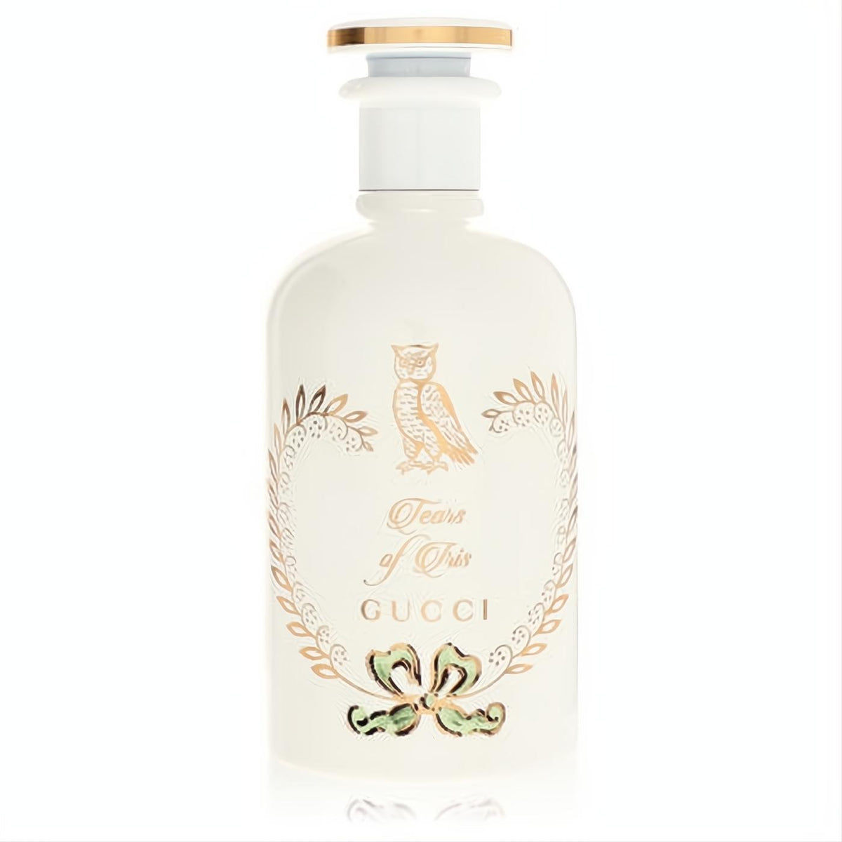 Exquisite Gucci Tears of Iris perfume bottle. Opaque white glass, adorned with a gold owl, 'Tears of Iris' script, and a delicate green bow. Gold cap.