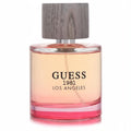 Guess 1981 Los Angeles 3.4 oz EDT spray. Elegant clear glass bottle with vibrant ombre peach-pink fragrance and a stylish wood-grain cap.