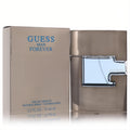 Guess Man Forever 2.5 oz EDT spray. Sleek champagne bottle with a modern design and striking blue Guess logo.