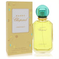 Happy Chopard Lemon Dulci 3.4 oz women's Eau De Parfum. Bright yellow liquid in a clear bottle with a vibrant teal cap, beside its cheerful patterned box.