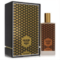 Ilha Do Mel Memo Paris 2.5 oz unisex EDP. Elegant frosted bottle with gold cap & geometric pattern, next to its luxurious black and gold box.