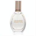 Jennifer Aniston Solstice Bloom 1.7 oz EDP: sleek clear glass oval bottle with a radiant rose gold cap.