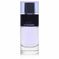 Jil Sander Softly Serene EDP tester. Elegant clear glass bottle with soft lavender liquid, striking black label, and chic purple cap.