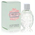 Jimmy Choo Floral mini .15 oz EDT: elegant clear textured bottle with silver cap, beside its chic mint green floral box.