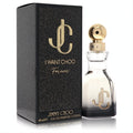 Jimmy Choo I Want Choo Forever 1.3 oz EDP. Elegant clear glass bottle with gold cap and iconic JC logo, beside a luxurious black textured box.