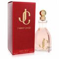 Jimmy Choo I Want Choo 3.3 oz EDP. Elegant clear bottle with pink liquid, gold cap & JC logo, beside a vibrant red textured box.
