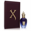 Experience Xerjoff Fatal Charme EDP: a vibrant blue bottle with gold cap, paired with its elegant burgundy stitched box featuring a bold gold 'X'.