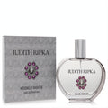 Judith Ripka Moonlit Nights 3.4 oz Eau de Parfum. Elegant clear glass bottle with silver cap and stunning purple jewel, next to its gray box.