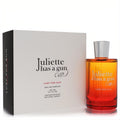 Juliette Has A Gun Lust For Sun 3.3 oz EDP spray in a vibrant ombre orange-red glass bottle with a sleek silver cap, beside its elegant white box.