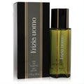 KRIZIA Uomo 1.7 oz EDT spray in an elegant olive green glass bottle with gold stripes and black cap, next to its matching black box.