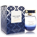 Kate Spade Sparkle Eau De Parfum Intense 3.3 oz. Luxurious blue ombre glass bottle with gold cap, beside its elegant floral pattern box.