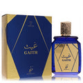 Khadlaj Gaith unisex EDP. Stunning deep blue bottle with textured gold cap, beside its elegant blue and gold geometric box.