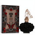 Captivating Anna Sui La Nuit De Bohème black rose perfume bottle with a golden butterfly cap, beside its ornate black & gold box.