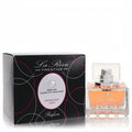Elegant La Rive Moonlight Lady EDP spray, clear square bottle with peach liquid, beside its black Swarovski crystal box.