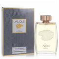 Lalique Pour Homme 4.2 oz EDP spray. Elegant clear bottle with a striking gold lion emblem, next to its luxurious textured black and gold box.