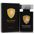 Tonino Lamborghini Prestigio 4.2 oz EDT. Elegant black bottle, silver cap, and matching box featuring the iconic gold bull crest.