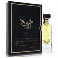 Lattafa Adeeb unisex Eau De Parfum, 2.7 oz. Exquisite black and gold box with calligraphy, alongside a clear rectangular bottle featuring a golden sprayer.