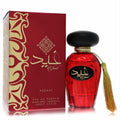 Elegant Lattafa Asdaaf Ghaid unisex Eau De Parfum. Deep red faceted bottle, gold tassel, and ornate matching box, 3.4 oz.