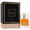 Lattafa Khamrah unisex 3.4 oz Eau De Parfum. Clear bottle, amber liquid, elegant black and gold box.
