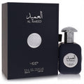 Sophisticated Lattafa Pride Al Ameed unisex 3.4 oz EDP fragrance. Dark blue bottle, unique silver textured cap, and elegant box.