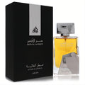 Lattafa Ser Al Ameer unisex Eau De Parfum. Elegant black box, striking amber liquid in a modern silver geometric bottle.