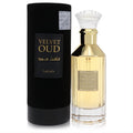 Luxurious Lattafa Velvet Oud 3.4 oz unisex EDP. Gold-accented ribbed glass bottle with faceted cap, beside its sleek black cylindrical box.