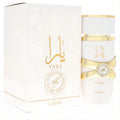 Luxurious Lattafa Yara Moi 3.4 oz EDP. White bottle with gold Arabic script, elegant ribbon detail, and matching box.