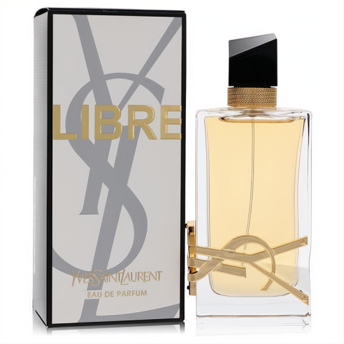 Sophisticated YSL Libre 3 oz Eau De Parfum bottle with golden liquid, sleek black cap, and iconic gold logo, next to its elegant white box.