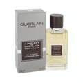 L'instant de Guerlain Pour Homme 1.6 oz EDT. Sophisticated clear glass bottle with amber fragrance and dark cap, alongside its sleek silver box.