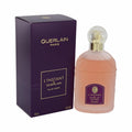 Exquisite L'instant de Guerlain 3.3 oz EDT. Frosted bottle with amber liquid, ornate gold cap, and a sophisticated dark purple box.