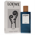 Experience Loewe 7 Cobalt 3.4 oz Eau de Parfum. Sleek cobalt blue bottle, natural wood cap, and elegant white box with fern art.