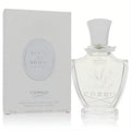 Luxurious Creed Love In White For Summer 2.5 oz EDP. Elegant clear glass bottle with white cap and leaf design, next to its pristine white box.