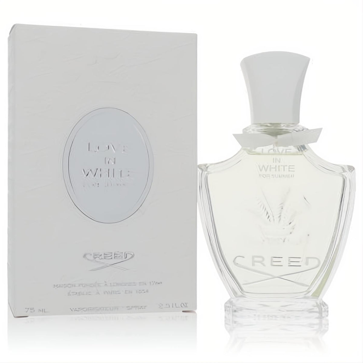 Luxurious Creed Love In White For Summer 2.5 oz EDP. Elegant clear glass bottle with white cap and leaf design, next to its pristine white box.