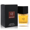 Luxurious YSL M7 men's Eau De Toilette spray, 2.7 oz. Amber liquid in a sleek clear bottle with black cap, beside its elegant black and red box.