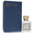 Elegant Maison Francis Kurkdjian Paris 724 unisex Eau de Parfum. Clear glass bottle, gold cap, luxurious navy blue box.