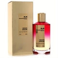 Elegant Mancera Indian Dream 4 oz EDP in a striking red-to-clear gradient glass bottle with a gold cap, next to its shimmering gold box.