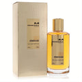 Elegant Mancera Intensitive Aoud Gold 4 oz unisex EDP. Clear bottle with golden liquid, shiny gold cap, and textured gold box.