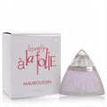 Mauboussin Lovely A La Folie 1.7 oz EDP. Frosted lavender triangular bottle with clear cap and elegant white box.