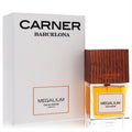 Carner Barcelona Megalium 3.4 oz unisex EDP spray. Clear bottle with golden liquid, dark wood cap, and elegant white box.